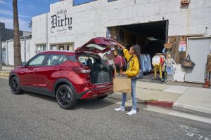 Girl loading 2021 Nissan Kicks trunk