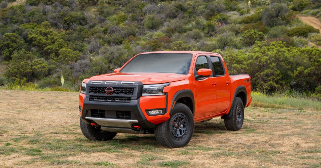 2025 Nissan Frontier parked on land with dry grass.