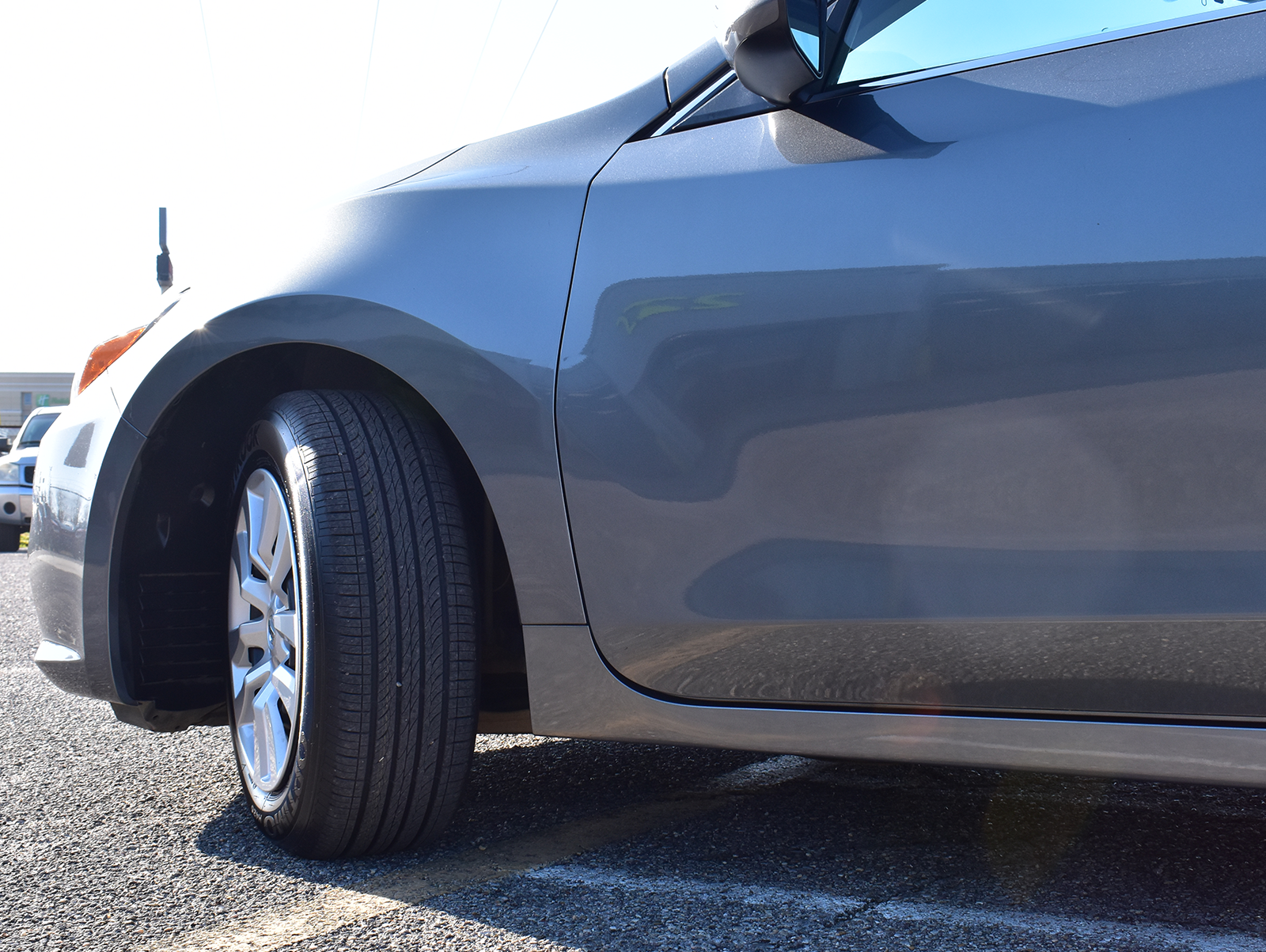 Nissan Service technician filling up tire