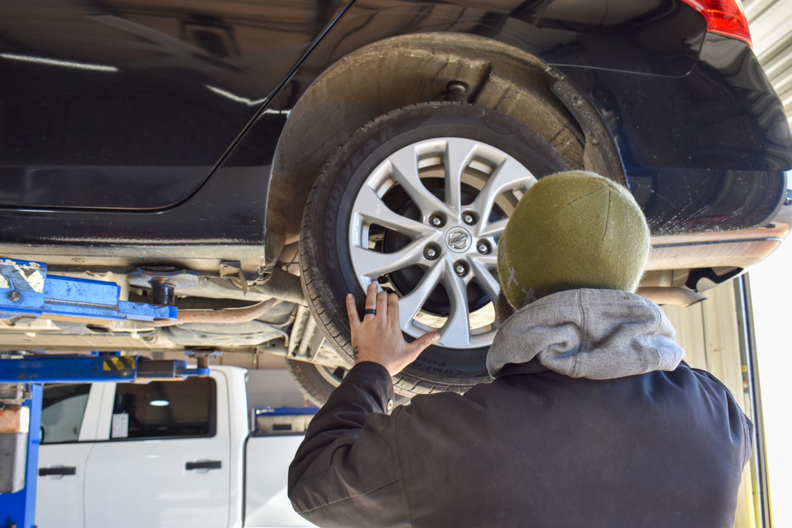 Nissan Technician Filling up a Tire