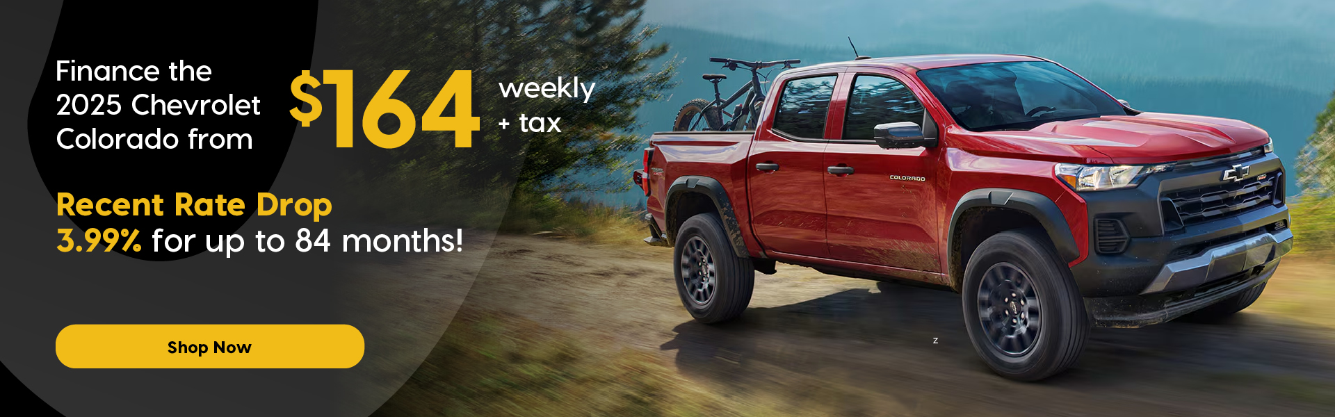 Promotional banner featuring a red 2025 Chevrolet Colorado driving on a mountain road. Text highlights: "Finance the 2025 Chevrolet Colorado from $164 weekly + tax," with a “Recent Rate Drop” of 3.99% for up to 84 months. Disclaimer text is included at the bottom. Button "Shop Now".