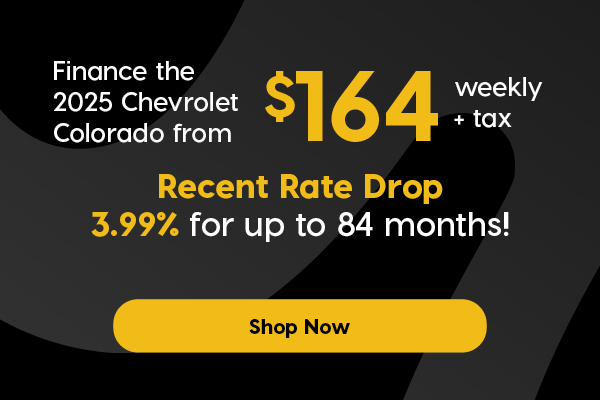 Promotional banner featuring a red 2025 Chevrolet Colorado driving on a mountain road. Text highlights: "Finance the 2025 Chevrolet Colorado from $164 weekly + tax," with a “Recent Rate Drop” of 3.99% for up to 84 months. Disclaimer text is included at the bottom. Button "Shop Now".