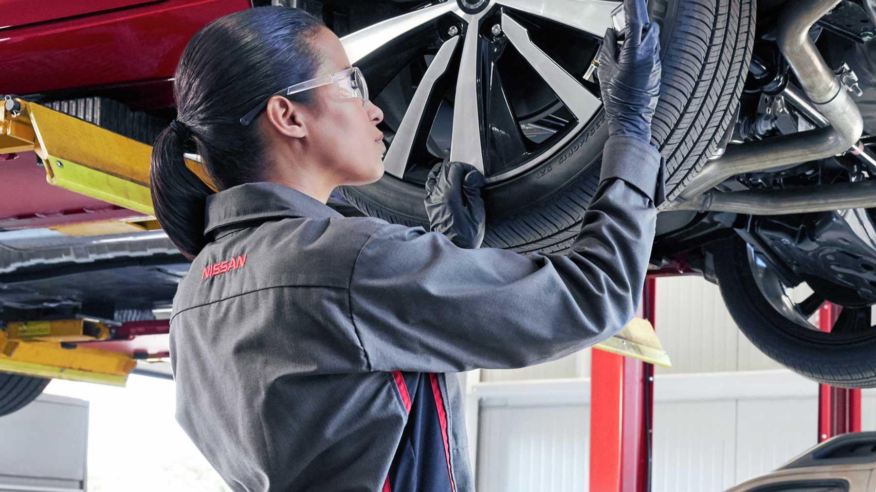 Nissan Technician Filling up a Tire