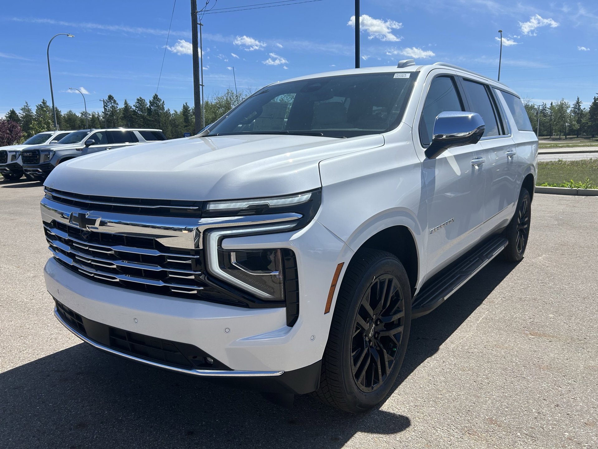 3/4 view of a 2025 Chevrolet Suburban parked at Summit GM