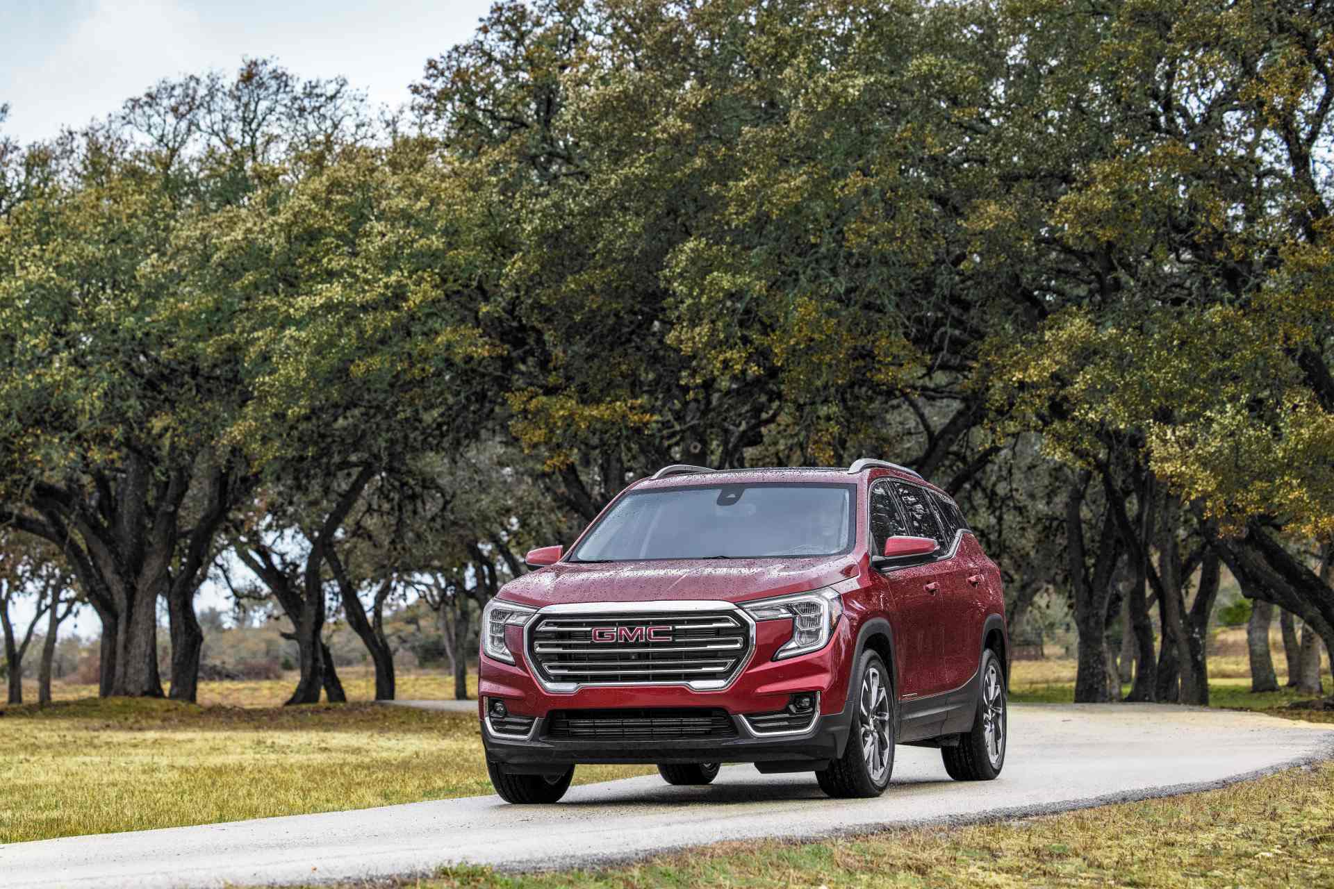 Test driving a used GMC Terrain on a winding private road