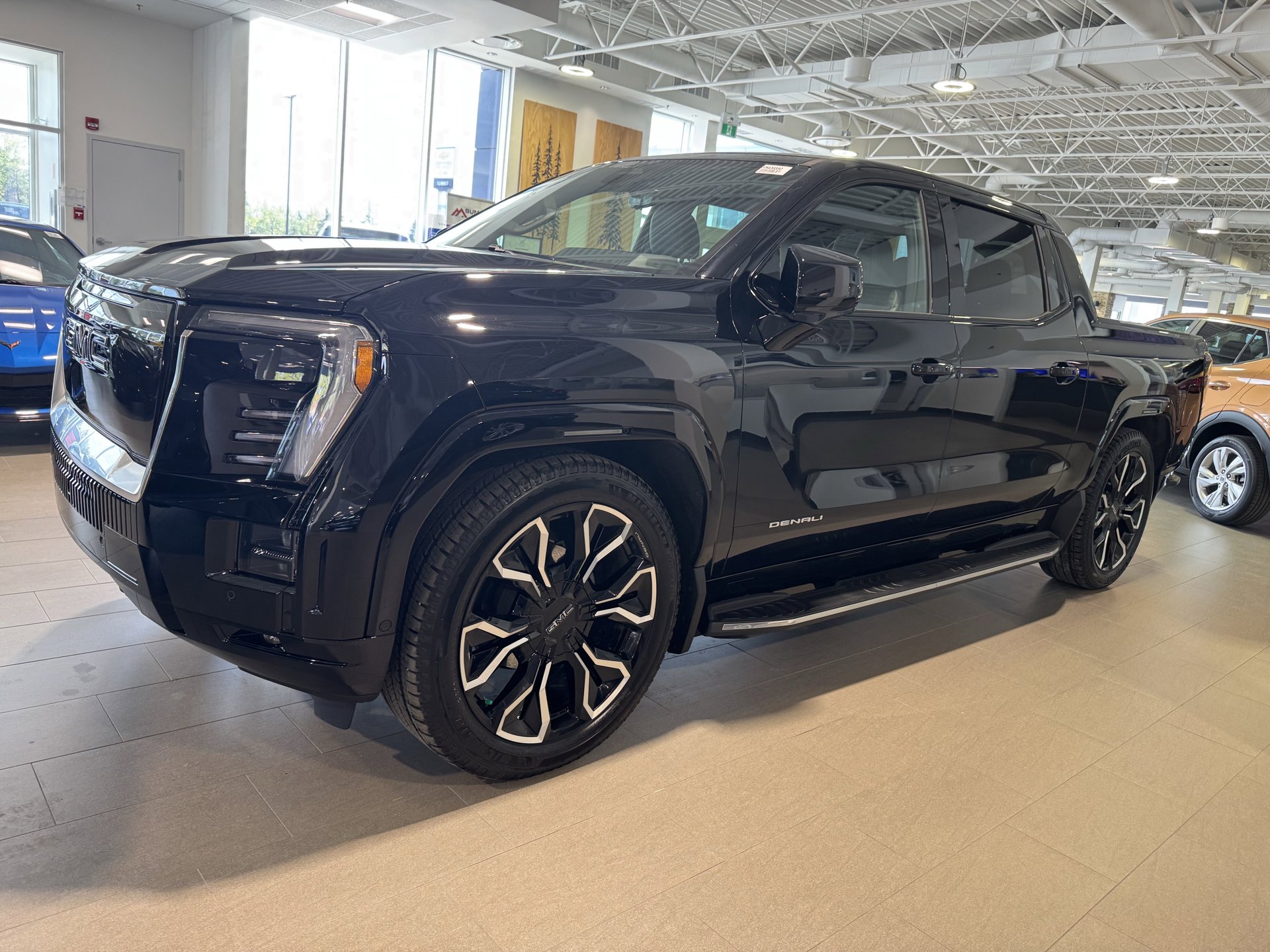 A GMC Sierra EV parked at Summit GM