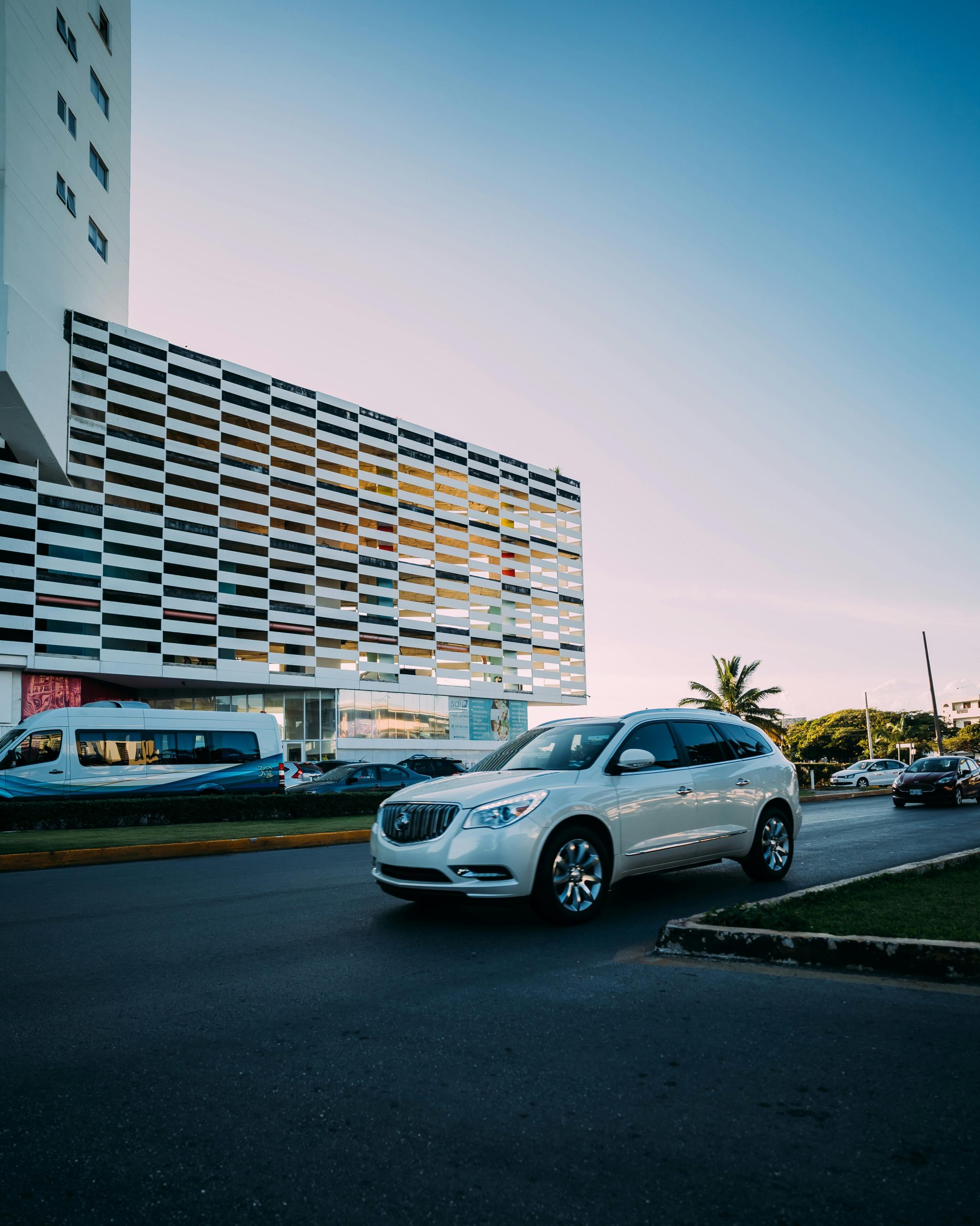 A Buick Encore GX driving through a city street
