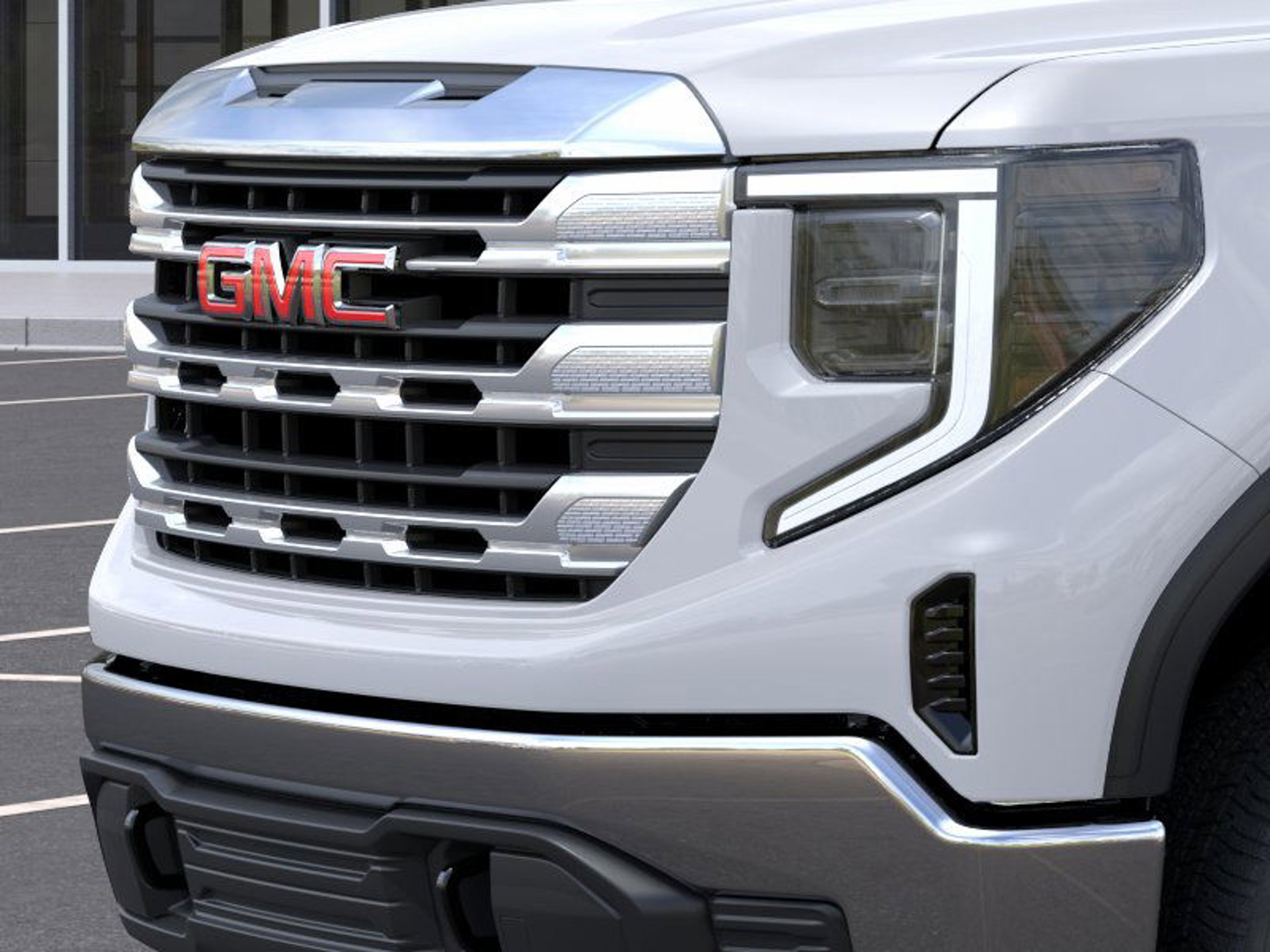 A close up of the GMC logo on the grille of the Sierra 1500.