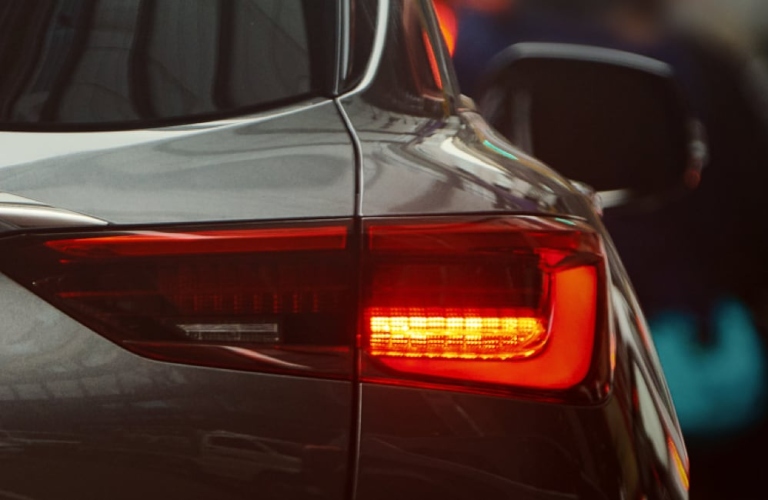 2022 INFINITI QX80 smart rear view mirror with passenger faces in it