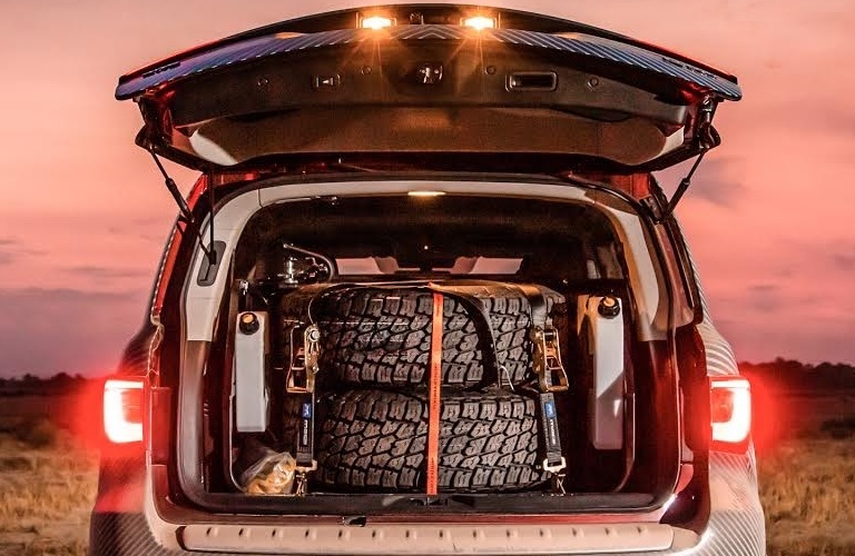 INFINITI QX80 at Rebelle Rally with tires in the back