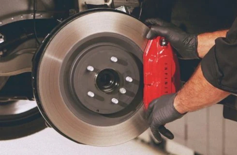mechanic working on brakes