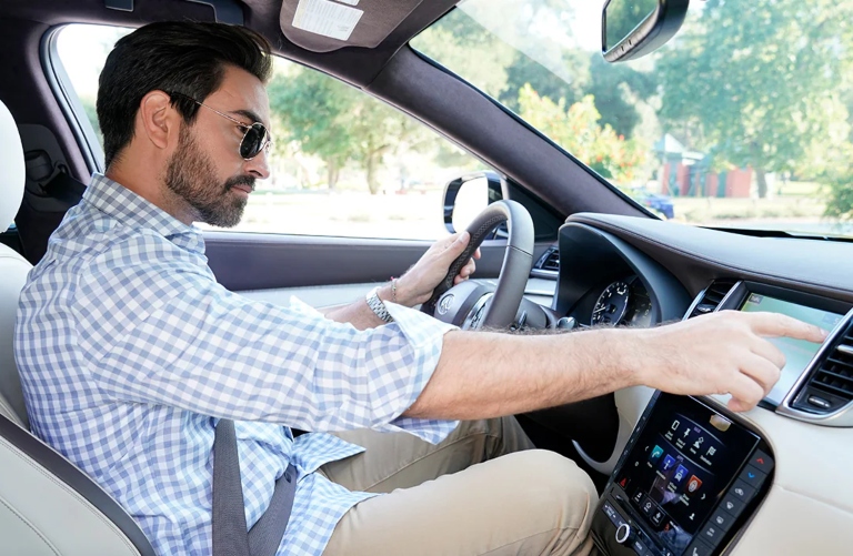 Man using INFINITI touchscreen