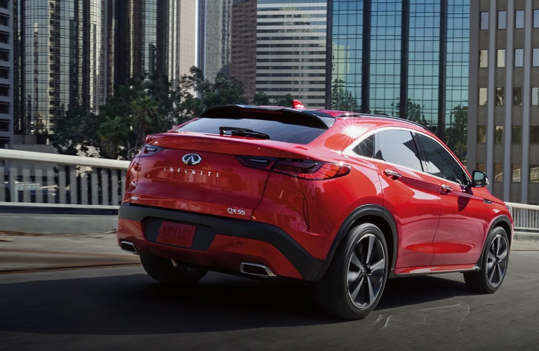 Red 2023 INFINITI QX55 Driving on Road