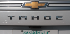 Close up the the Chevrolet Tahoe emblems and Saskatchewan license plate