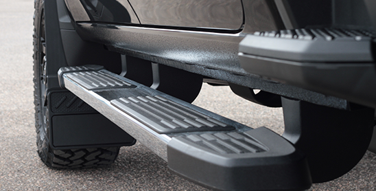 Close up of running board and mud flaps on truck 