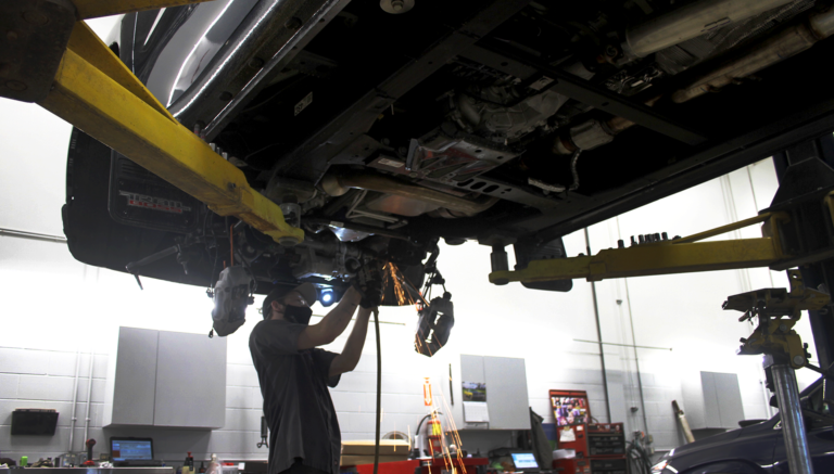 Service Technician working under truck