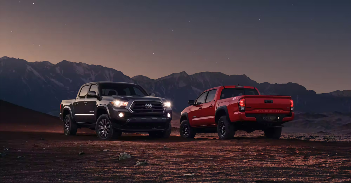 2023 Toyota Tacoma - Red and black in front of hills