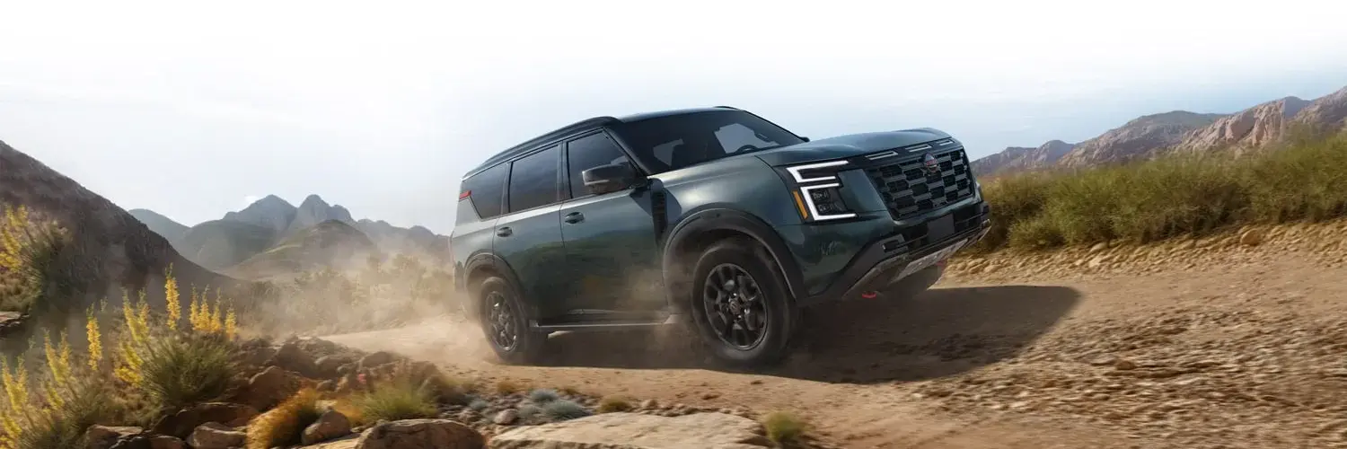 2026 Nissan Armada driving on a dirt road