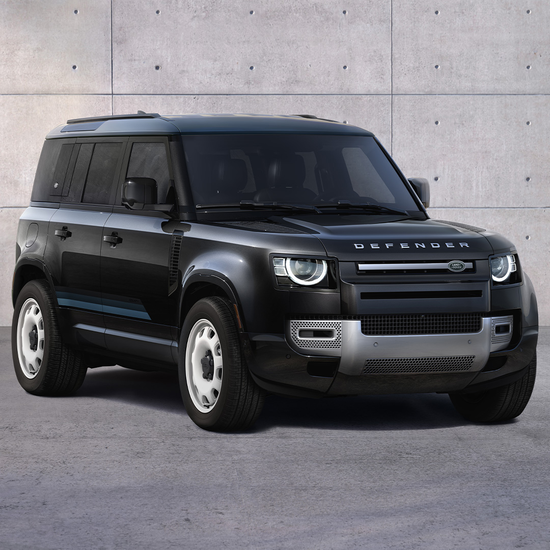 2024 Defender 110 with distinctive exterior parked against a concrete wall