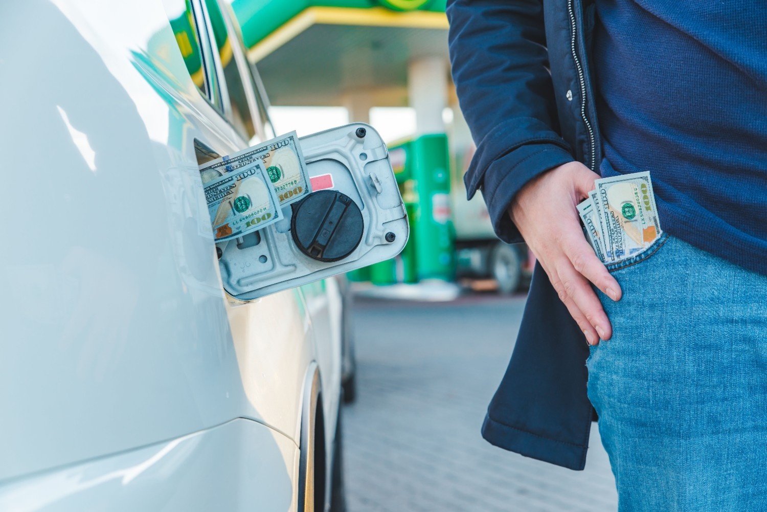 Money-In-Car-Tank-Dollars-In-Man-Pocket-Gasoline-Price-Hike