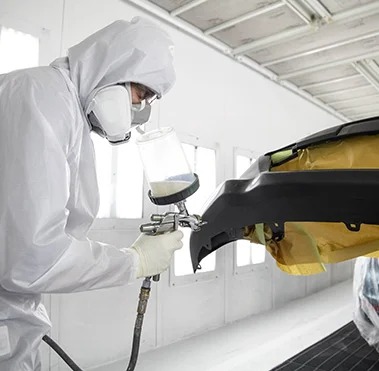 Collision Center Technician Painting a Vehicle | Mike Kelly Toyota of Uniontown in Uniontown PA