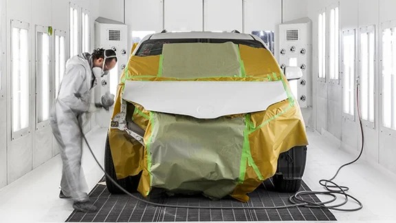 Collision Center Technician Painting a Vehicle | Mike Kelly Toyota of Uniontown in Uniontown PA