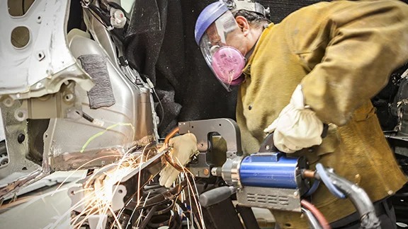 Collision Center Technician Repairing Vehicle | Mike Kelly Toyota of Uniontown in Uniontown PA