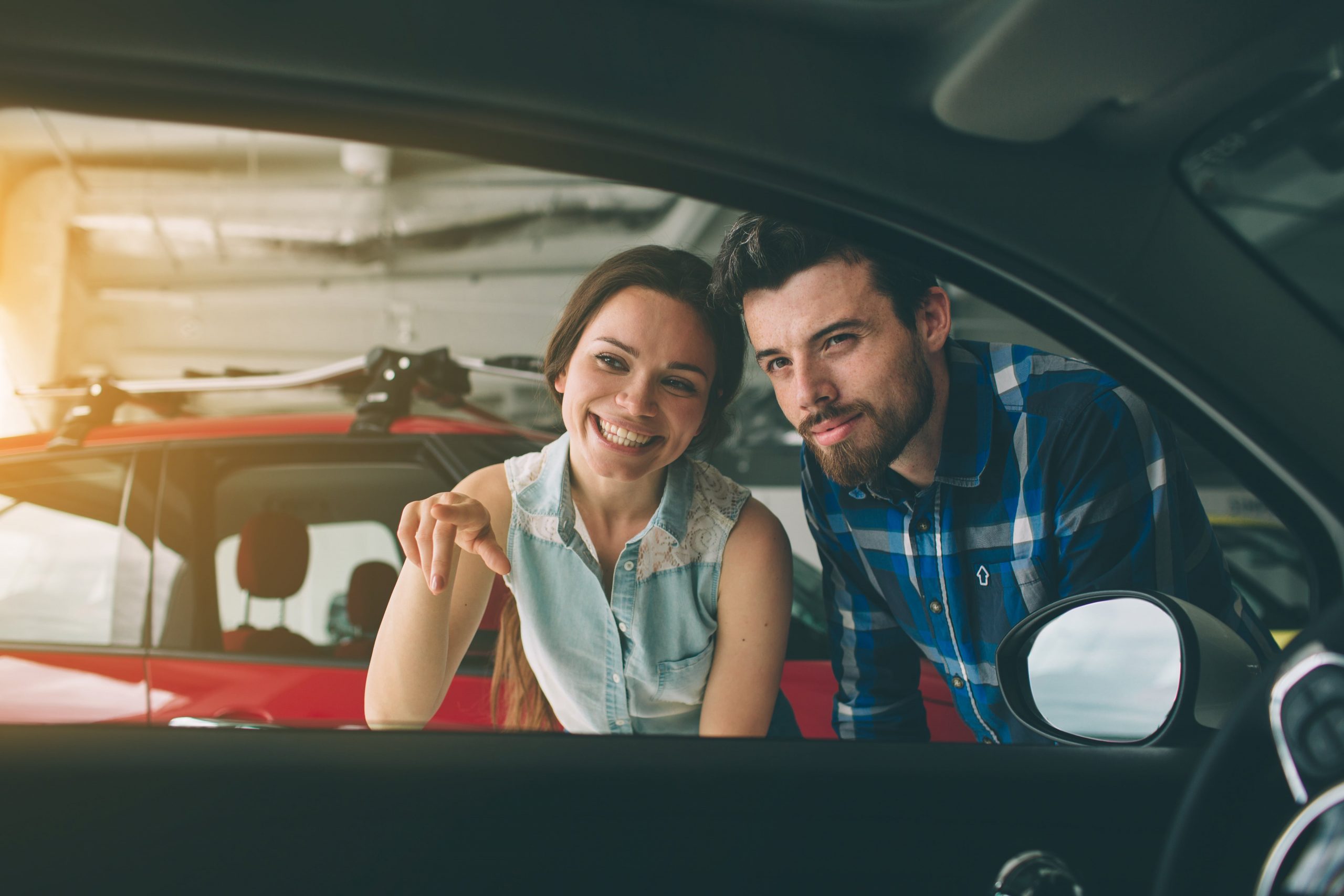 Couple Inspecting a Vehicle