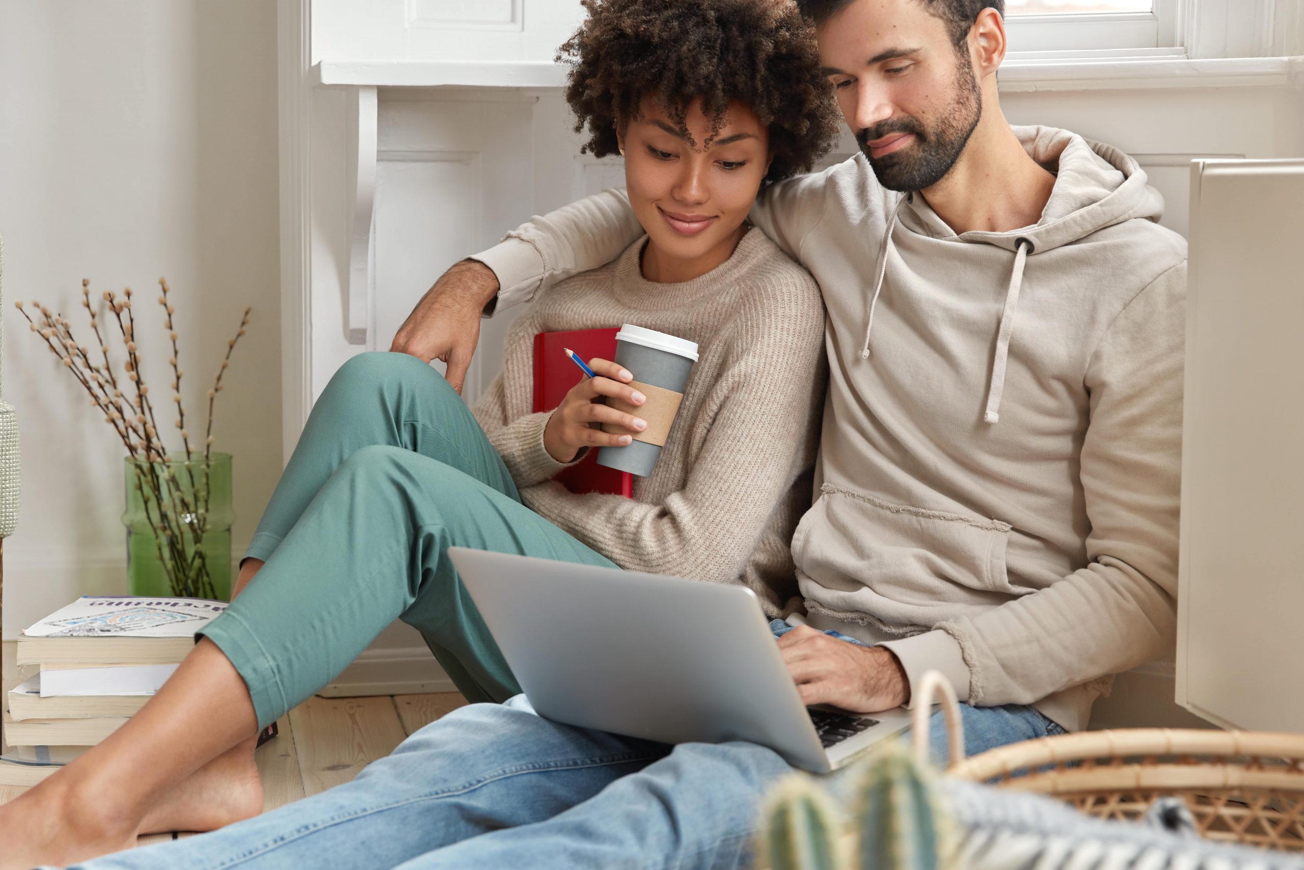 Couple looking at a computer in their home