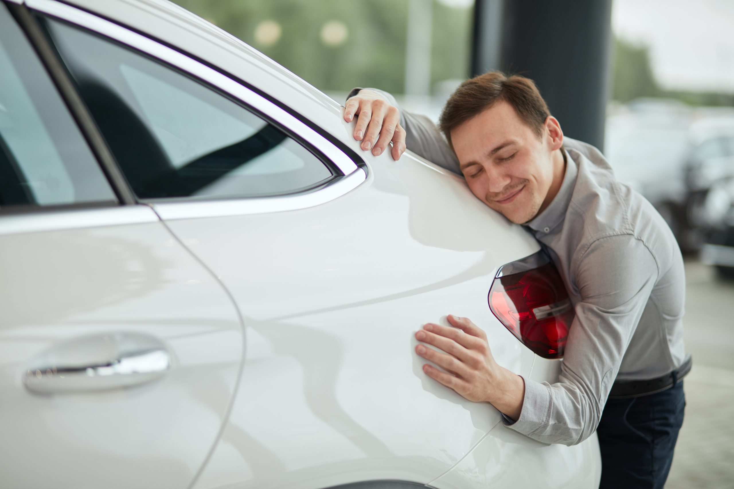 Man hugging his new car from Vista Motors