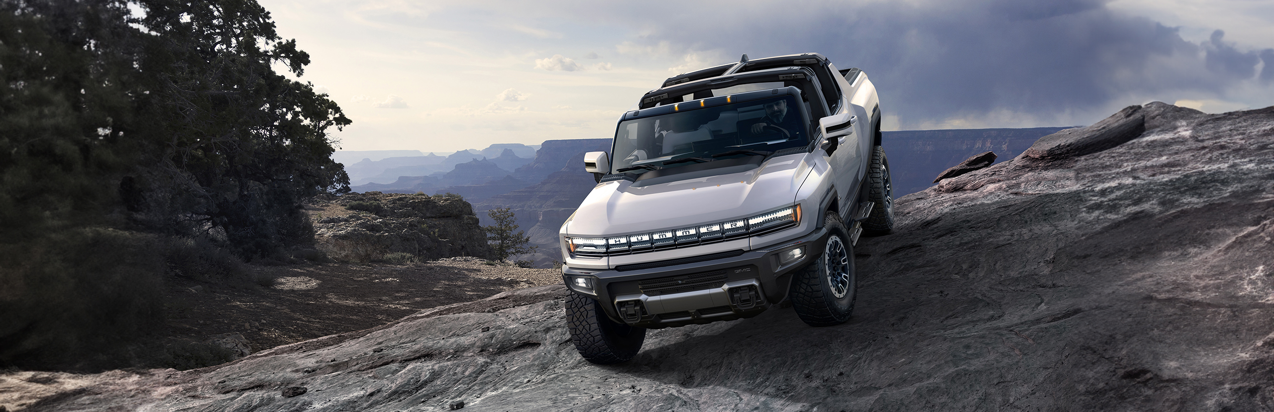 2024 Hummer EV pickup parked on a cliff edge