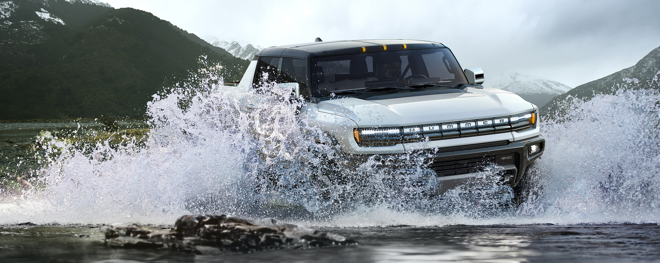 2024 Hummer EV pickup driving through water