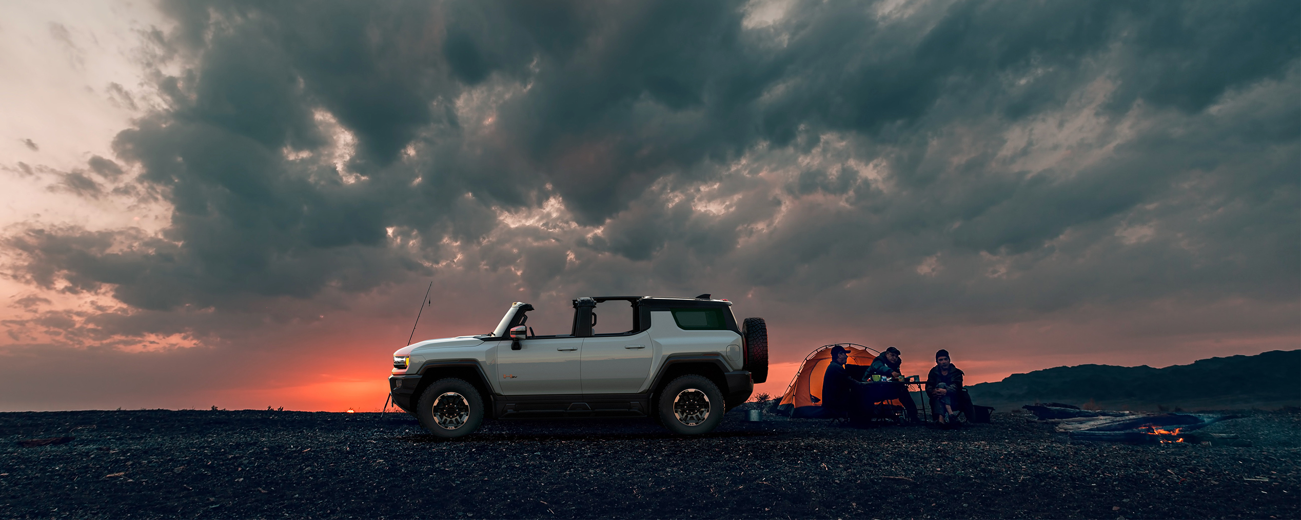 2024 Hummer EV parked at a campsite