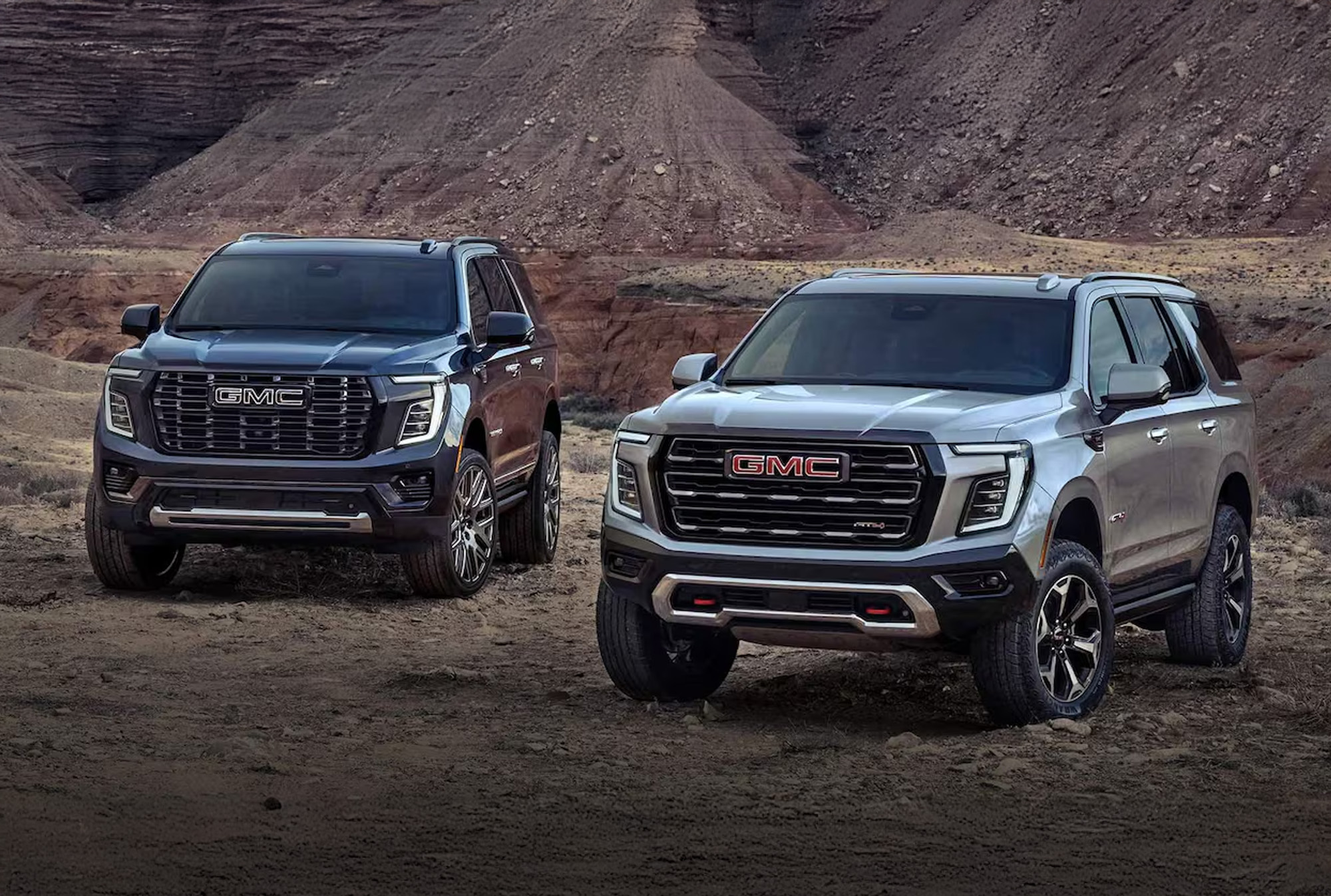 2025 GMC Yukon and Yukon XL parked near a canyon