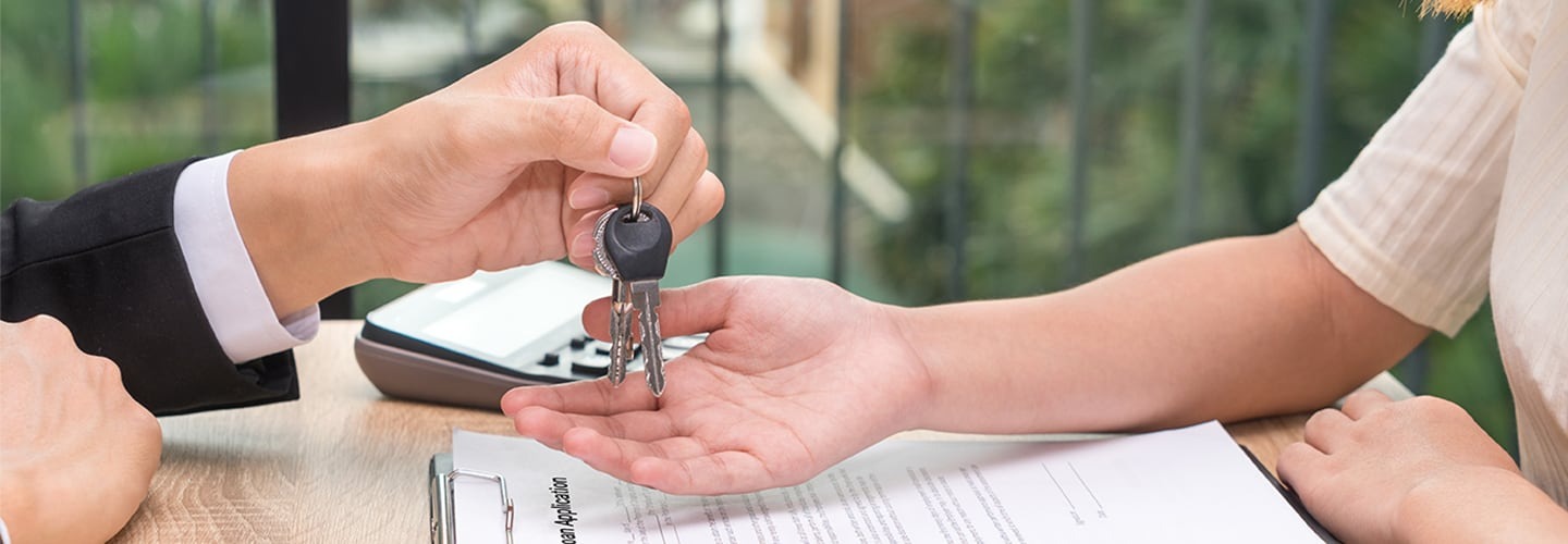 Keys being handed over to the new car owner