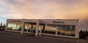 dealership at sunset