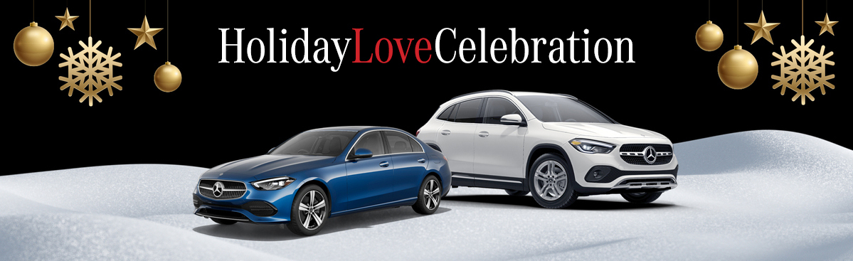 The Mercedes-Benz Holiday Love celebration sales banner featuring a Mercedes-Benz model lineup on display and winter holiday decorations