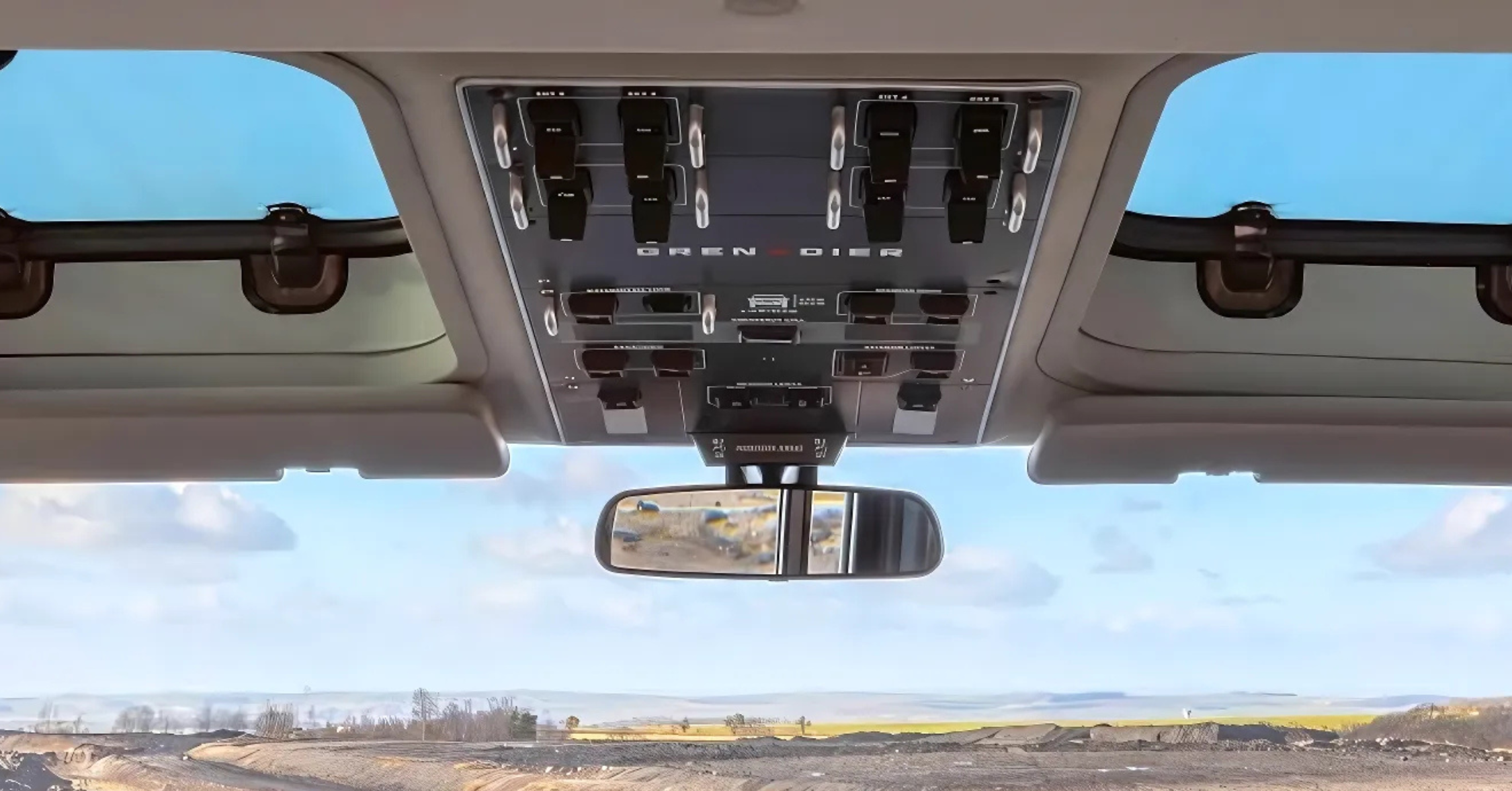 INEOS Grenadier station wagon overhead controls and rear view mirror with the sunroof open