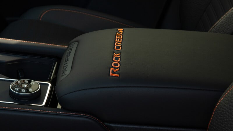 2023 Nissan Pathfinder Rock Creek center console with Rock Creek logo