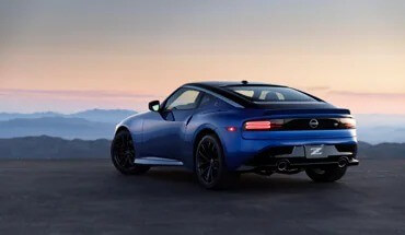 Rear View Of Blue Metallic 2023 Nissan Z At Dusk With Brake Lights On