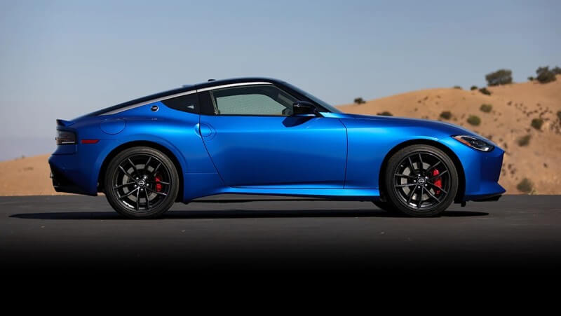 Side View Of Blue Metallic 2023 Nissan Z In The Desert