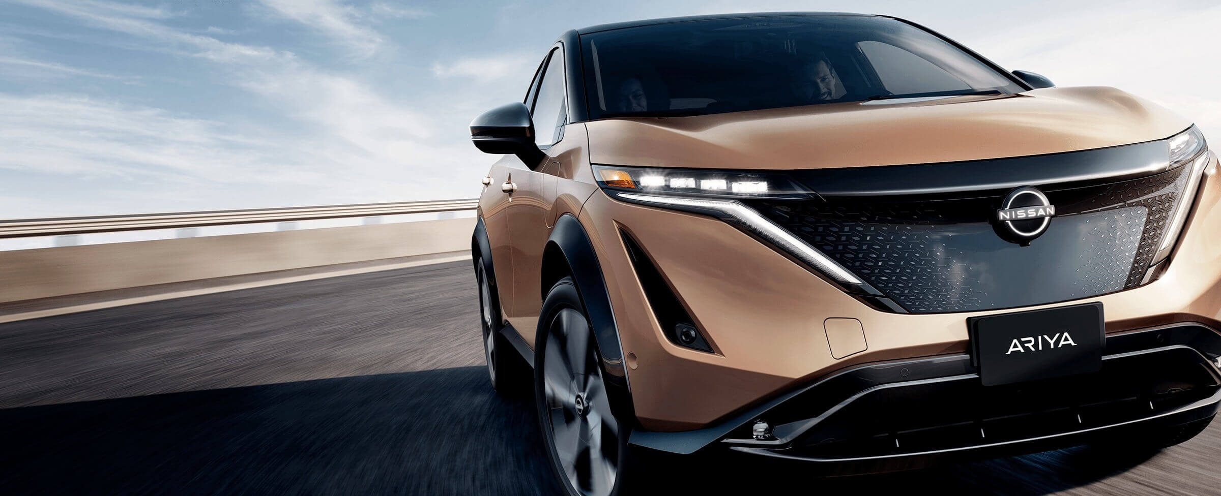 Nissan ARIYA close-up on open road